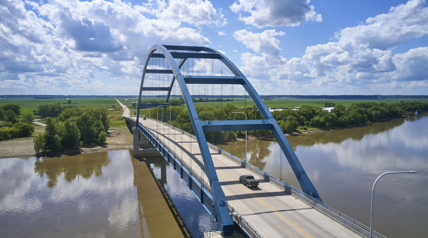 An aerial view of a bridge over a river.