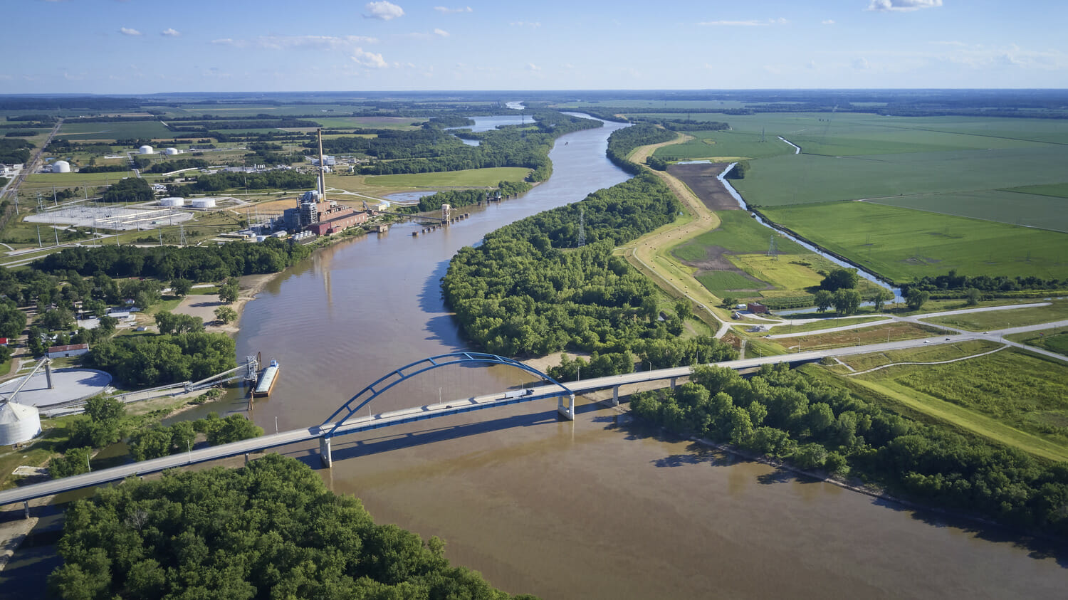 An aerial view of a river and a bridge.