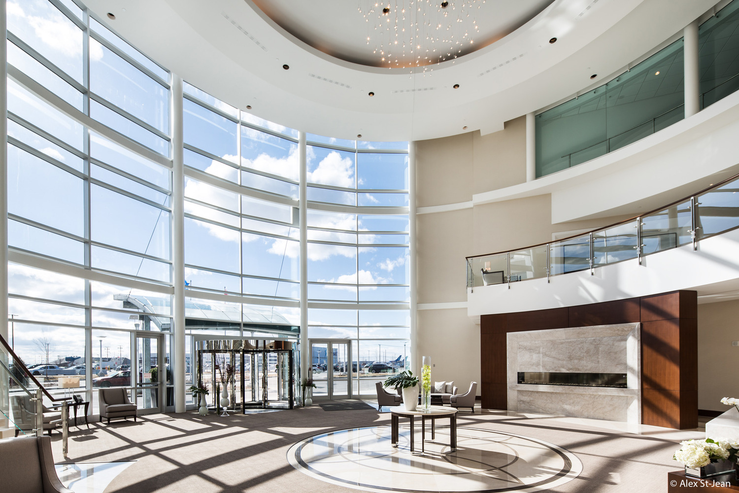 The lobby of a modern building with large windows.