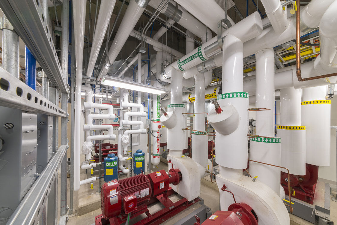 A room full of pipes and pipes in a building.