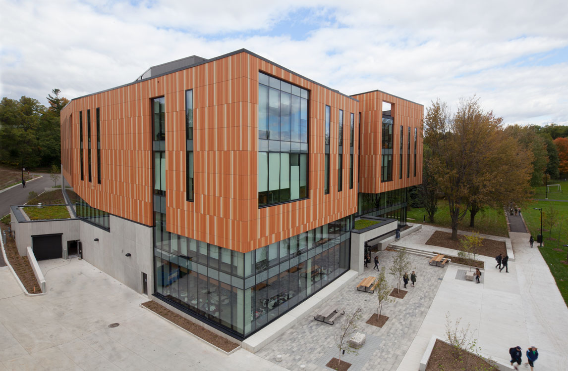 An aerial view of a building with wood siding.