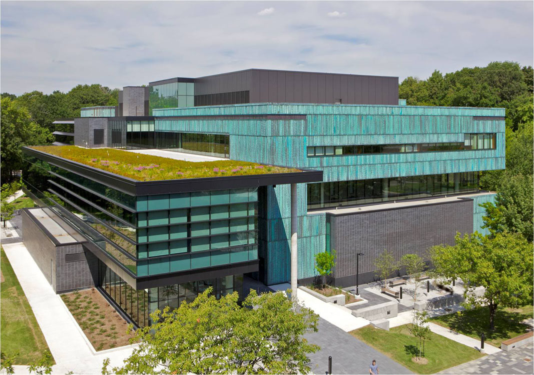 An aerial view of a building with a green roof.