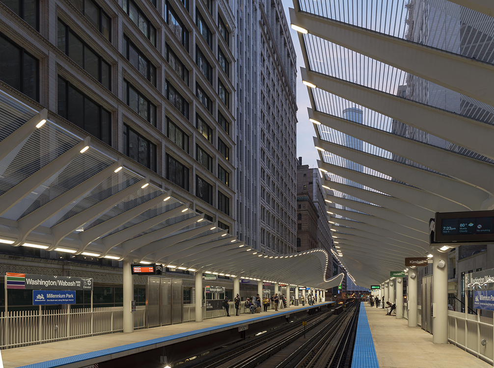 A train is on a platform at a train station.