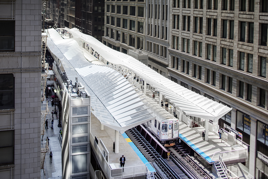 A train traveling down a track in a city.