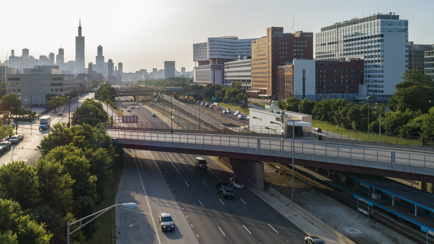 An aerial view of a highway with cars driving on it.