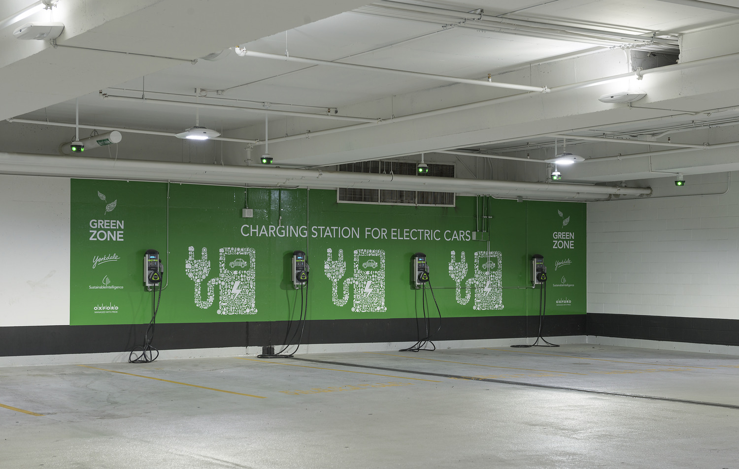 An electric car charging station in a parking garage.