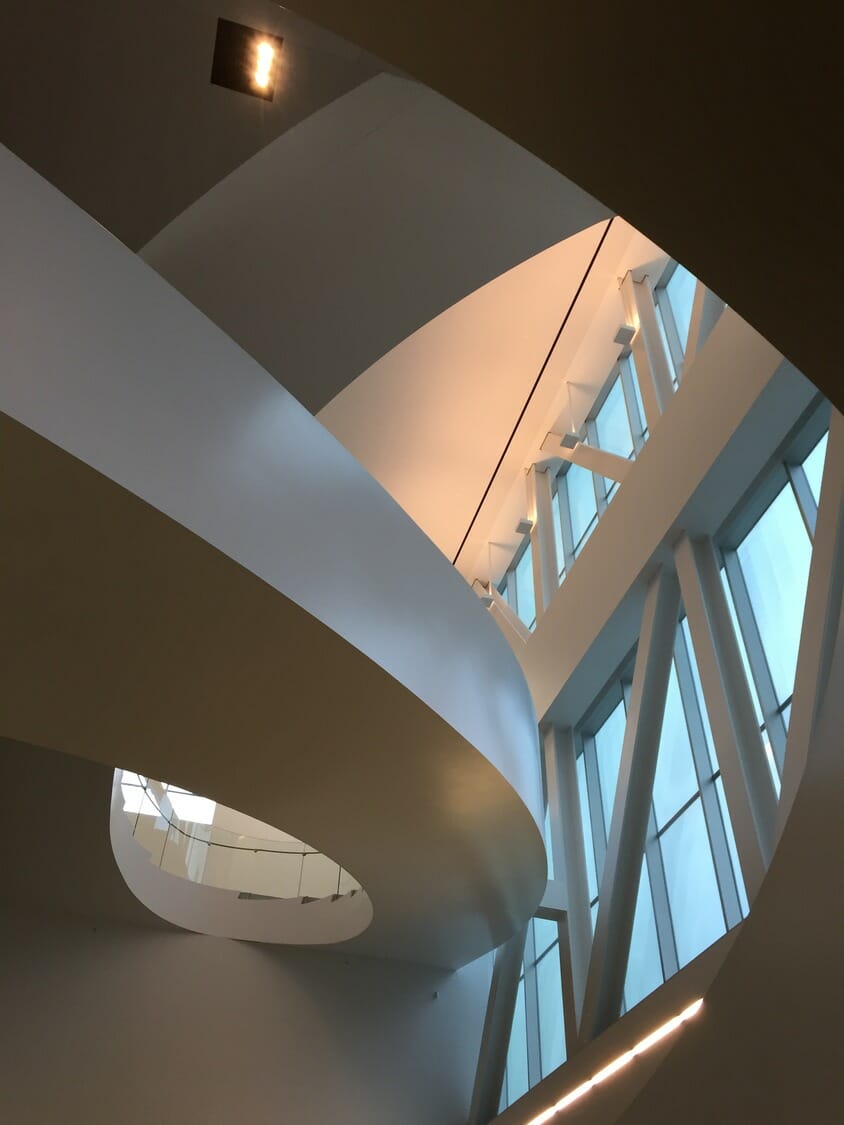 The inside of a building with a spiral staircase.