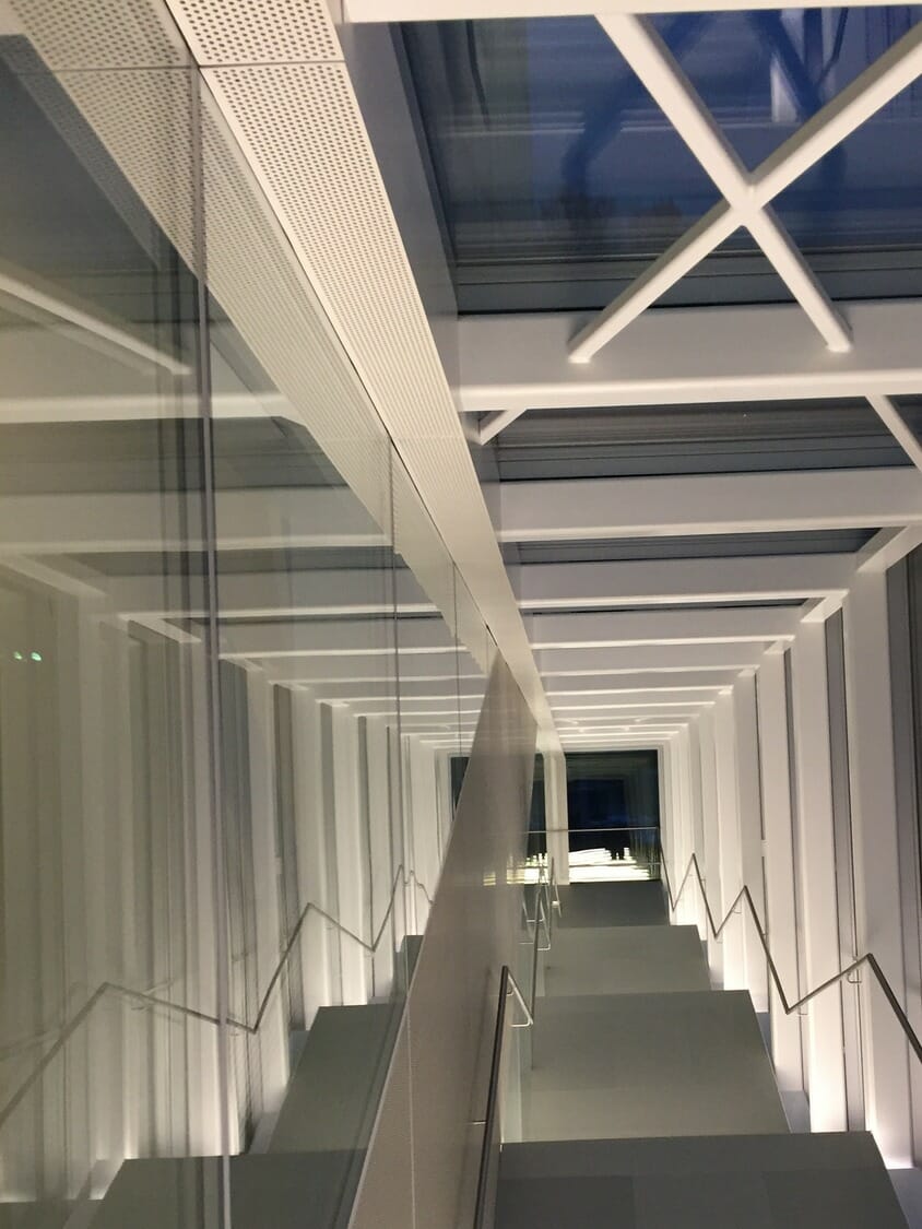 A glass stairway in a modern building.
