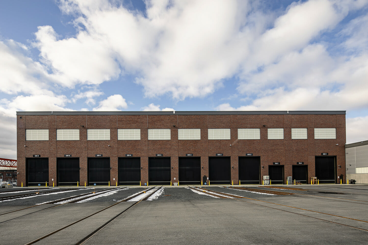 A brick building with a blue sky.