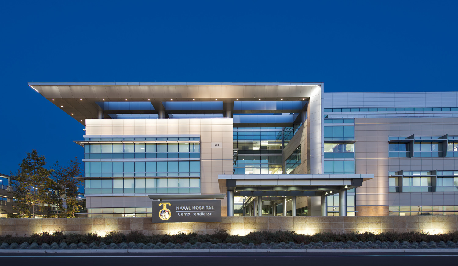 The exterior of a large building at night.