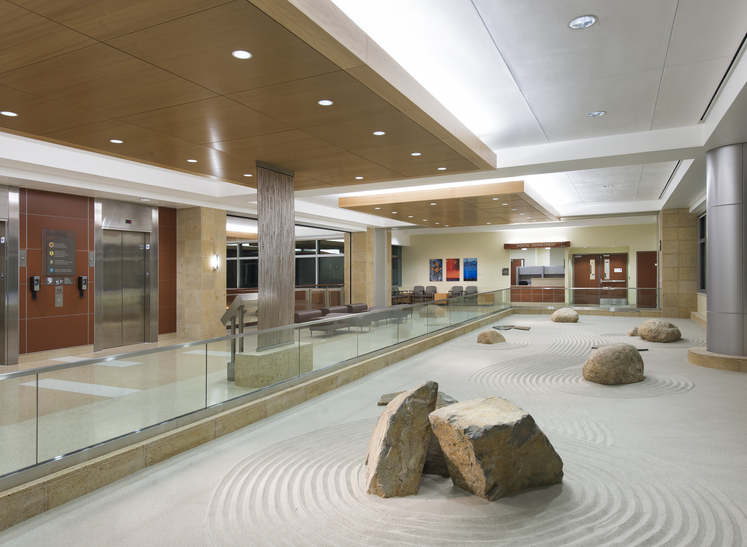 A large stone in the middle of a walkway.