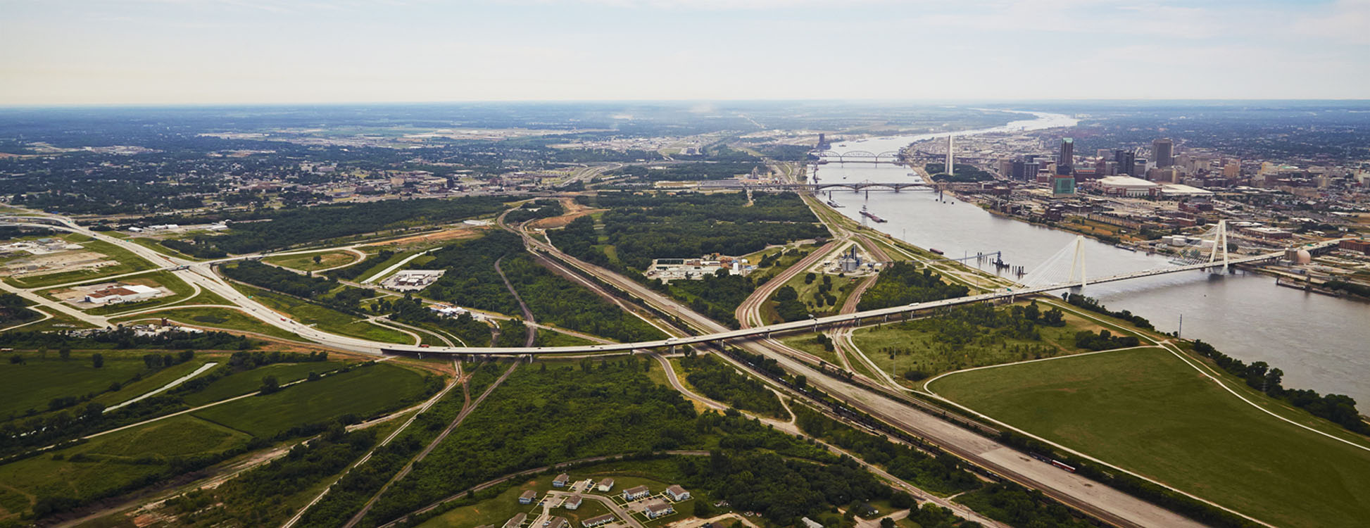 An aerial view of a city and a bridge.