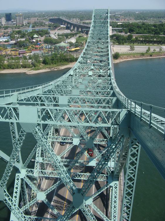 An aerial view of a bridge over a body of water.