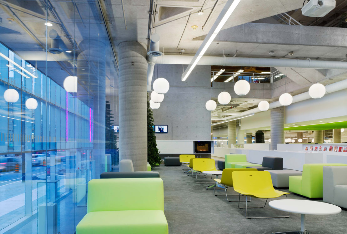 A brightly colored lounge area in a modern office.