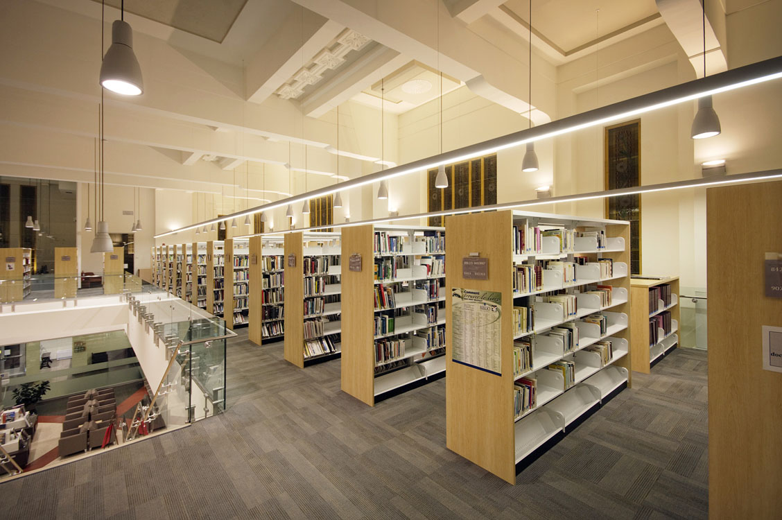 A library with a lot of books on shelves.