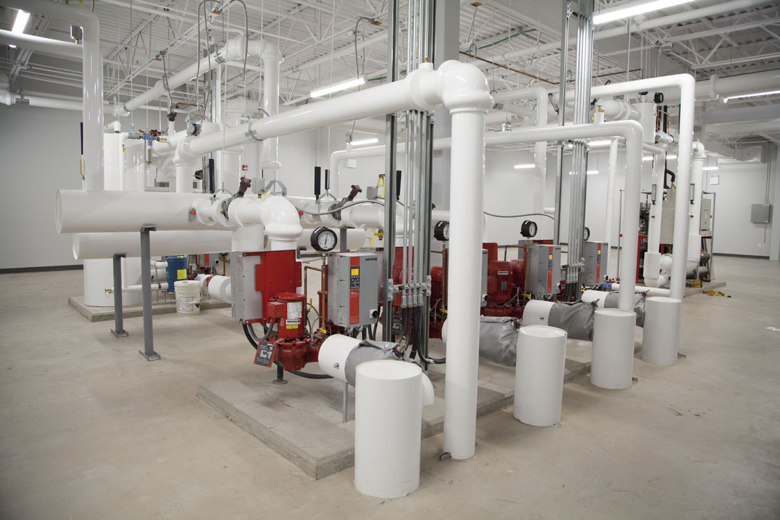 A large room with many pipes and valves.