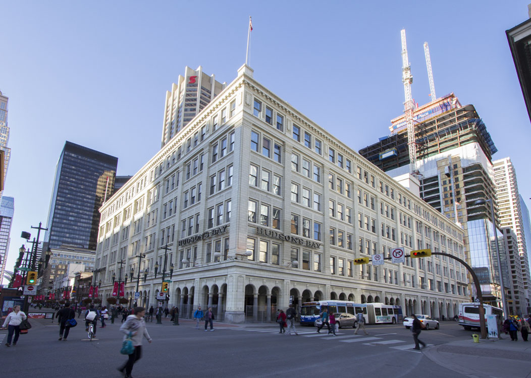 A large building in the middle of a street.