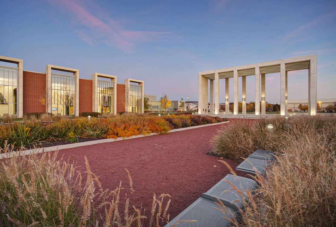 A building with a grassy area in front of it.