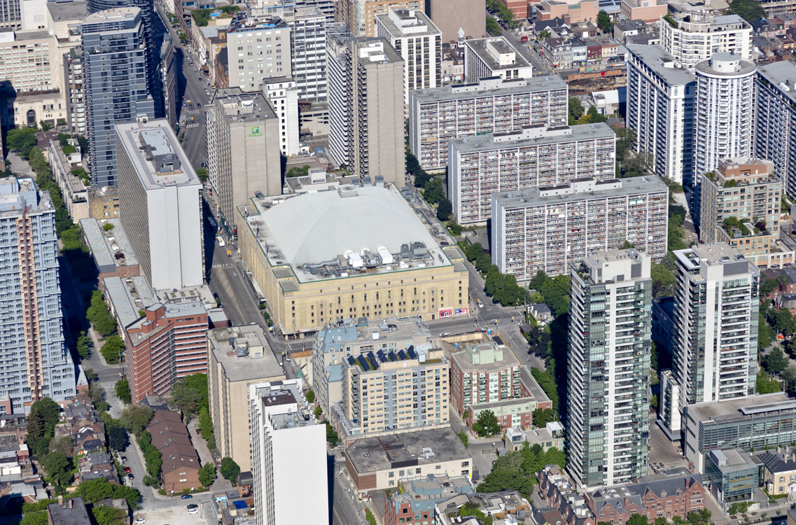 An aerial view of a city with tall buildings.