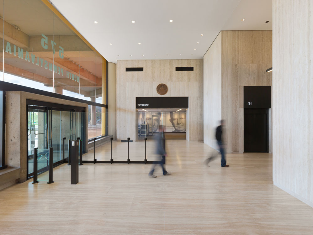 A large lobby with people walking through it.