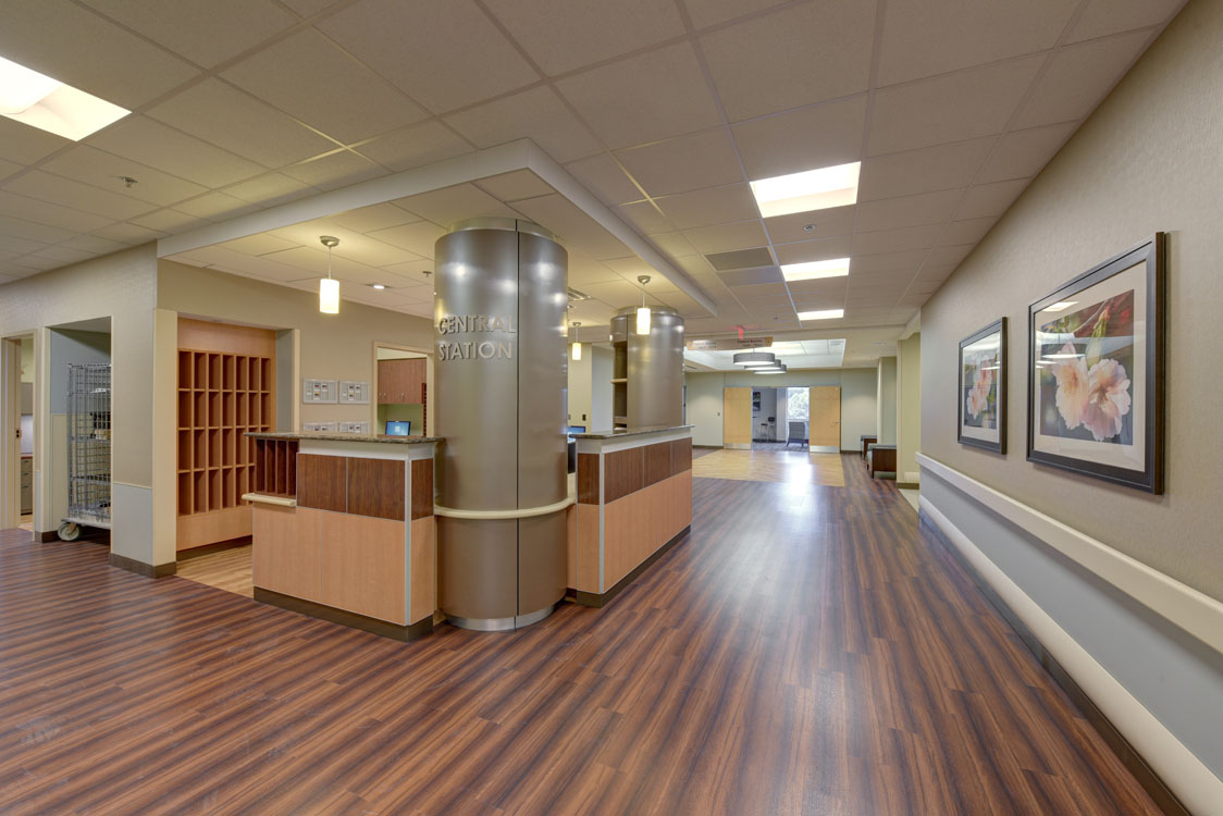 The reception area of a hospital with wooden floors.