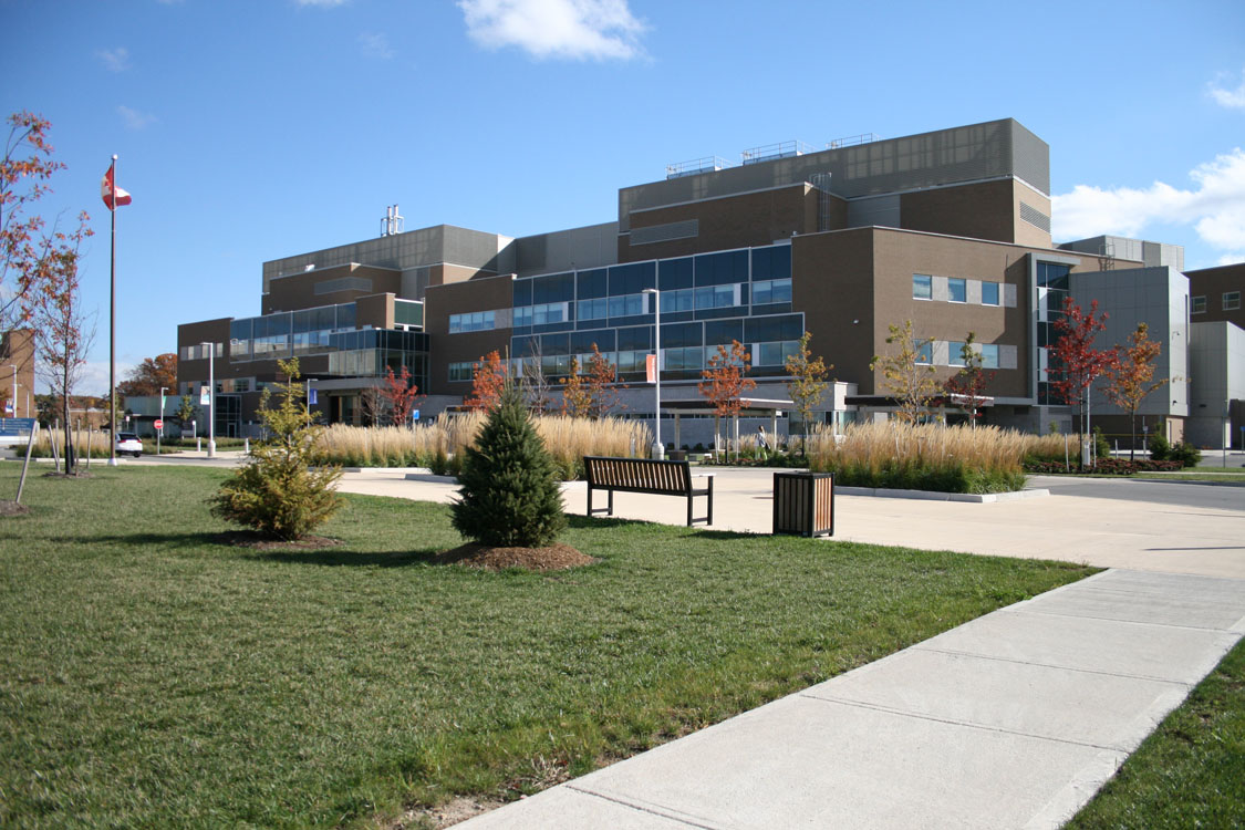 A grassy area in front of a building.