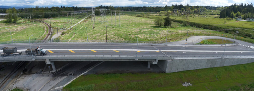 An aerial view of a bridge over a highway.