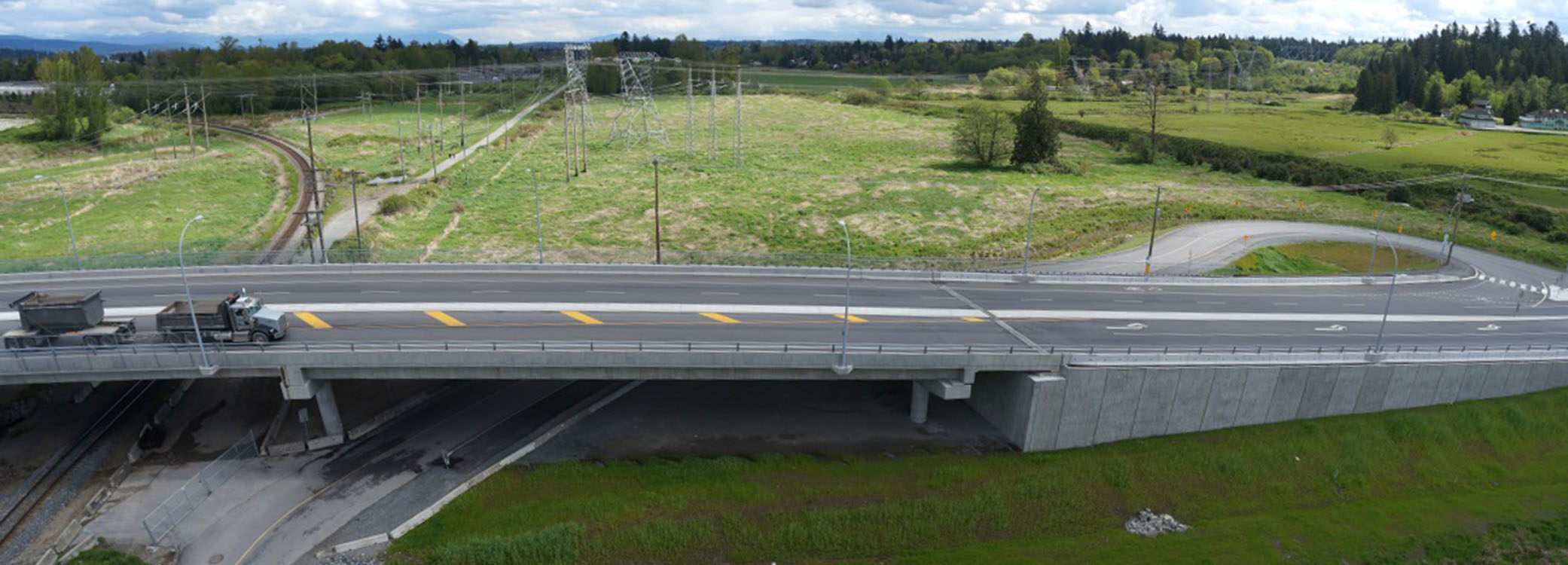 An aerial view of a bridge over a highway.