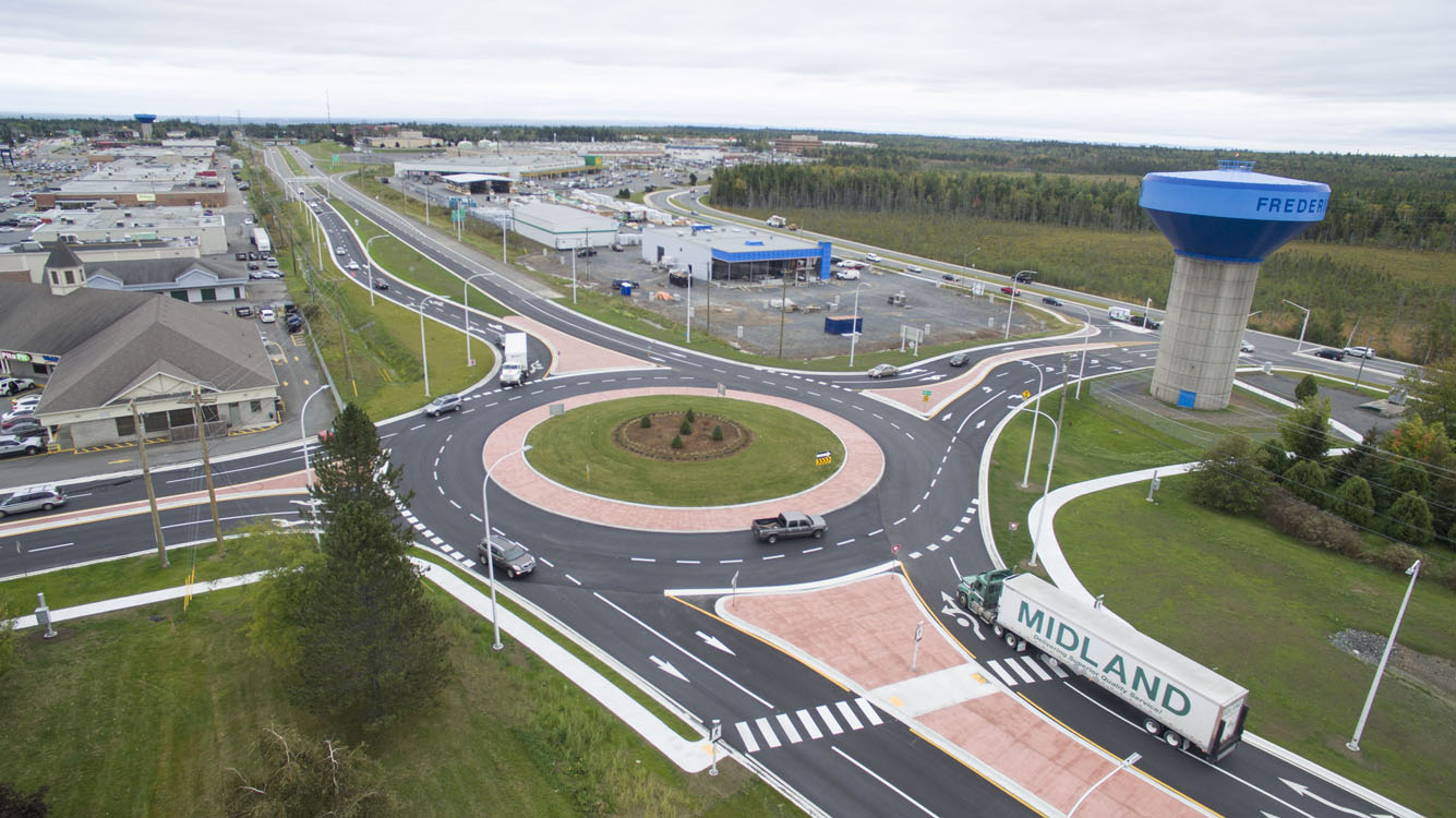 An aerial view of a roundabout in a town.