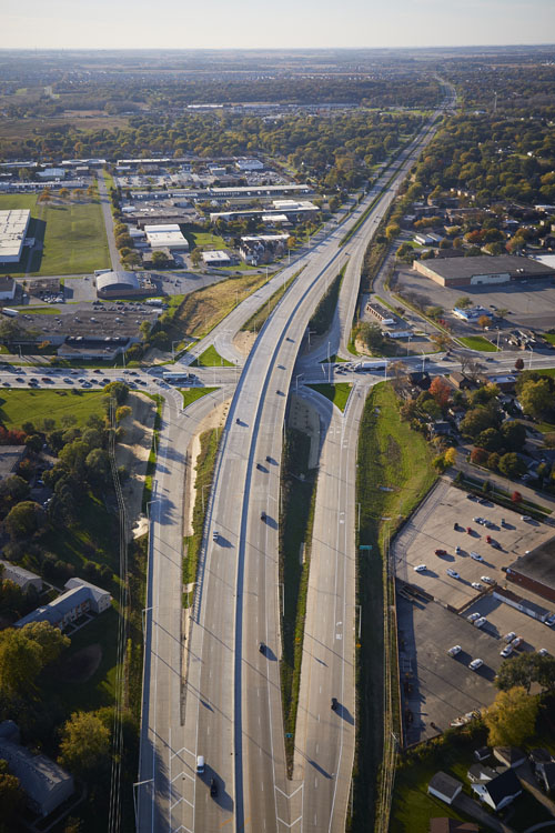 An aerial view of a highway with cars on it.