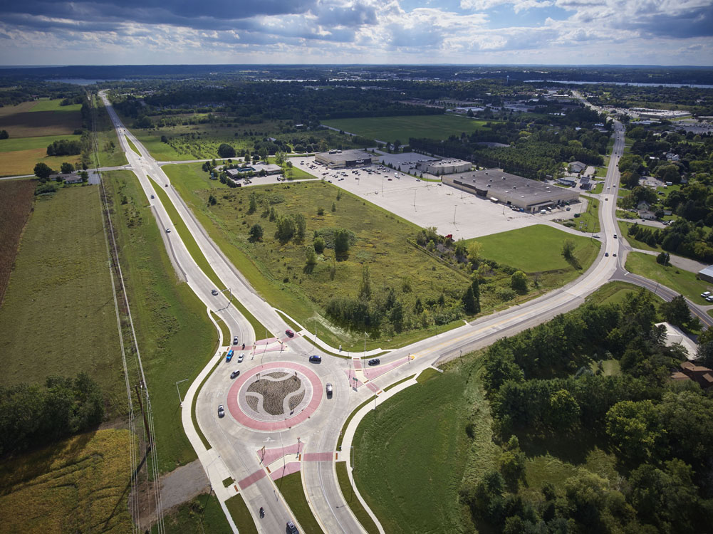 An aerial view of a roundabout in a rural area.