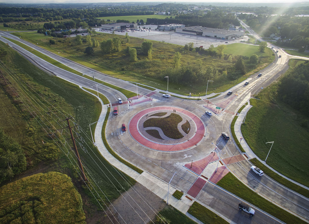 An aerial view of a roundabout in a rural area.
