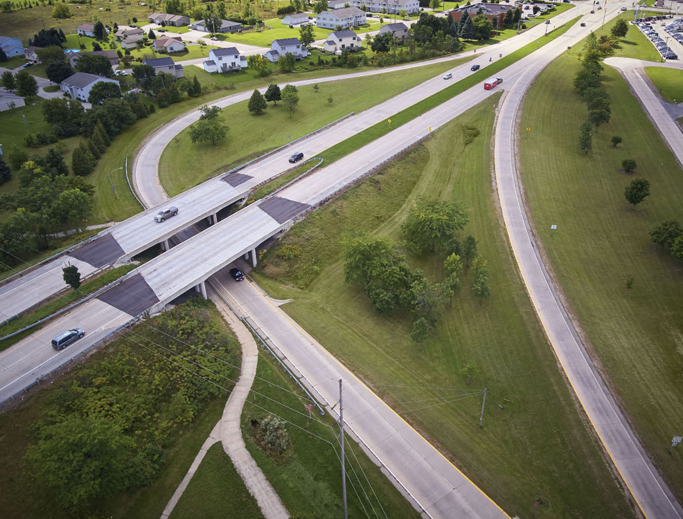 An aerial view of a highway with cars on it.
