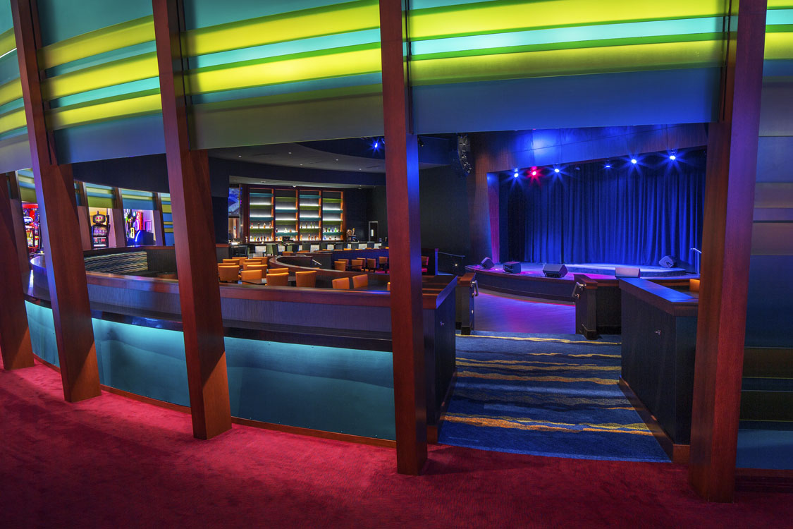 A view of a theater with a colorful carpet.