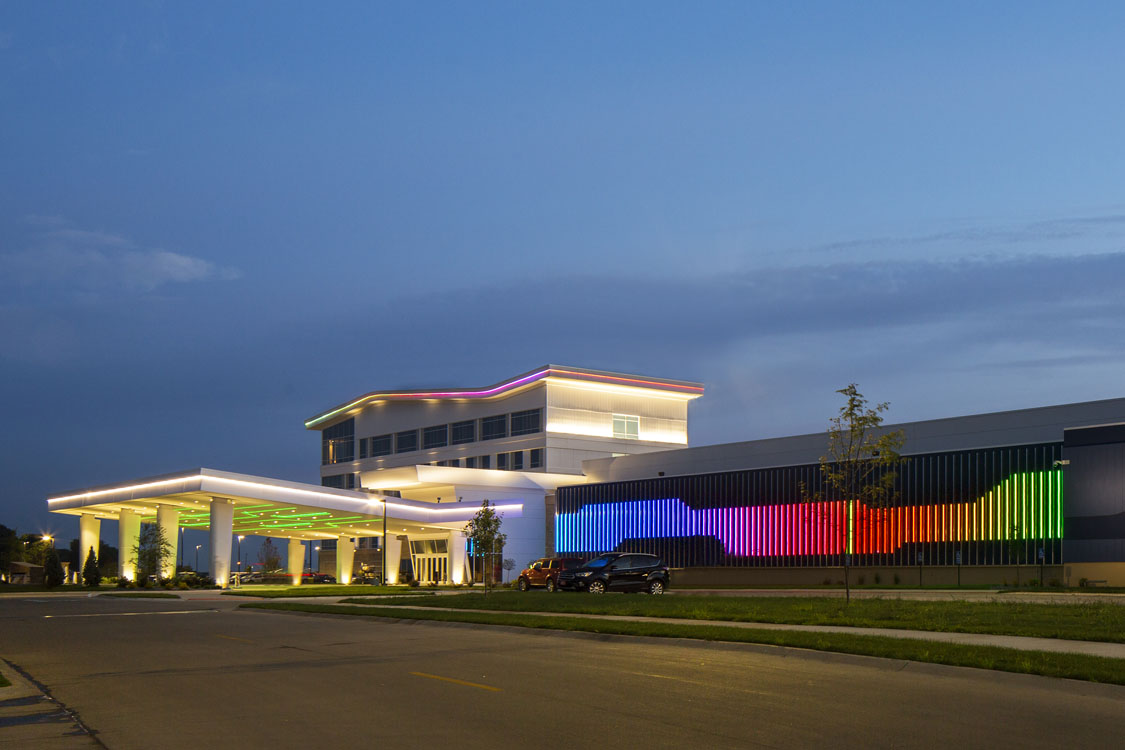 A building with a rainbow colored light on it.