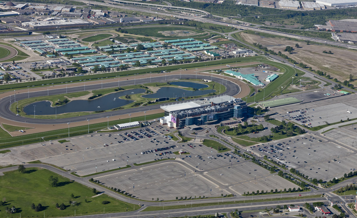 An aerial view of a race track and parking lot.