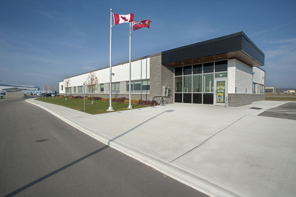 A canadian flag is flying over a building.