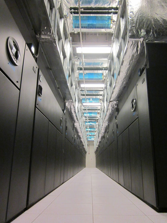 A long hallway with a lot of black cabinets.