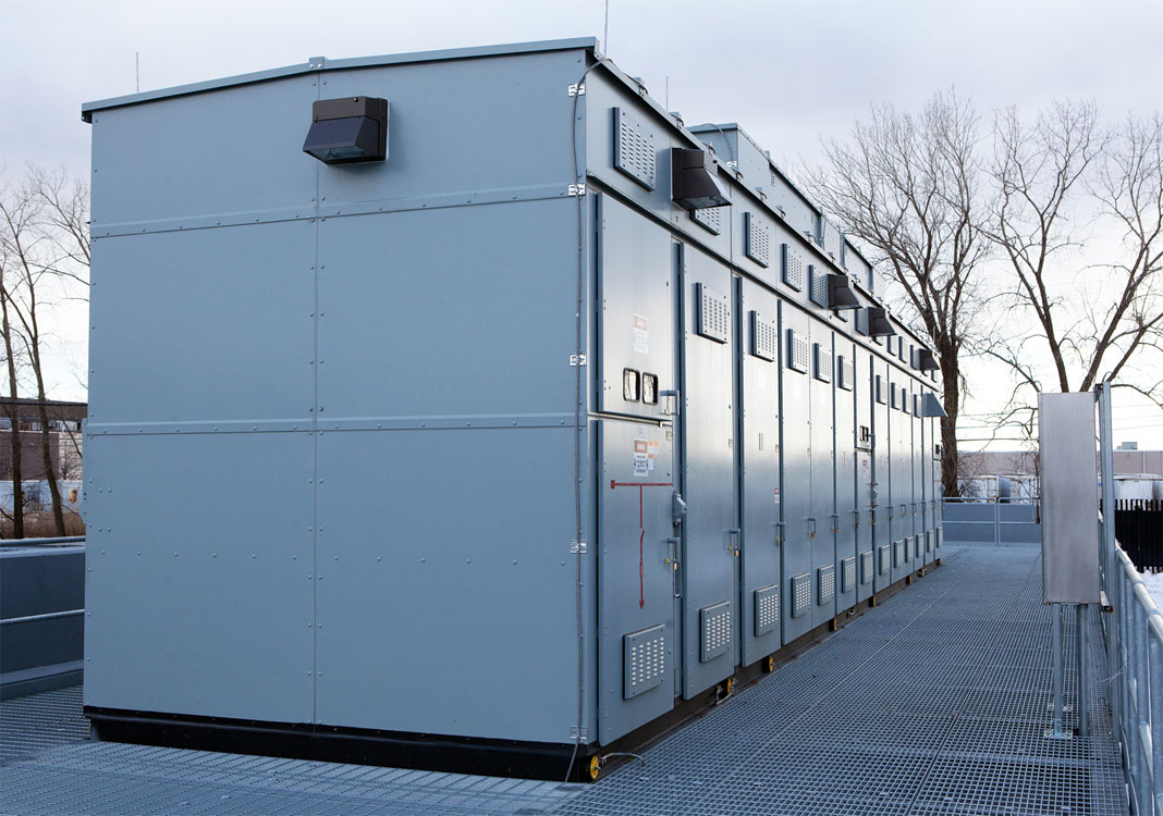 A large metal building on the side of a road.