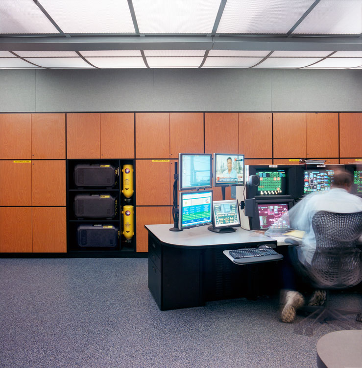 A man is sitting at a desk.