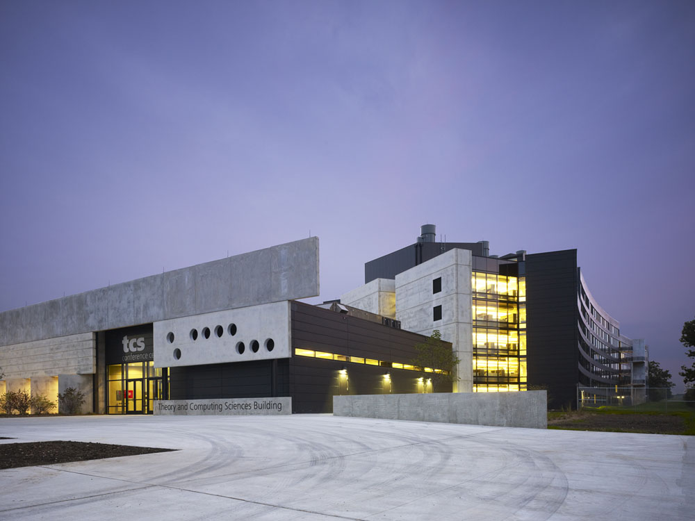 The exterior of a building at dusk.