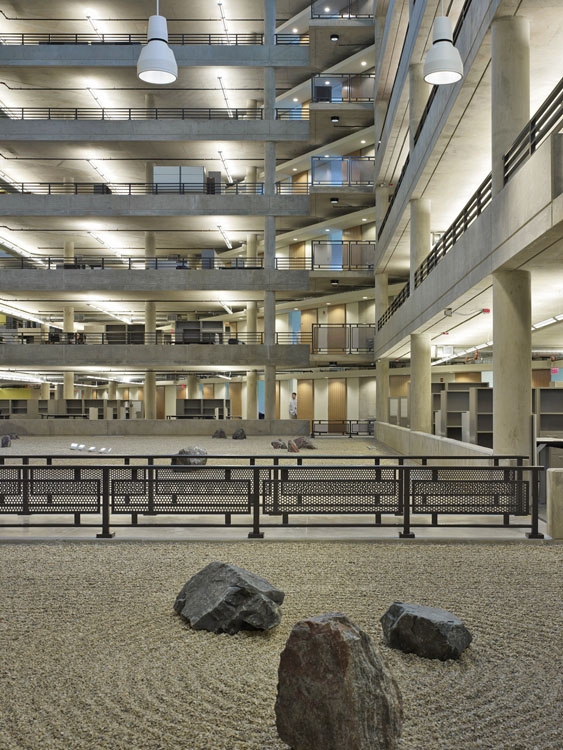 A large stone in the middle of a large building.