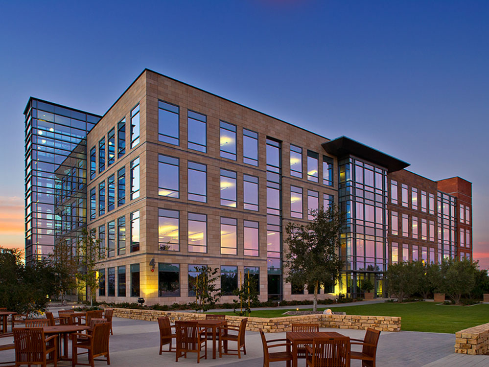 A large office building at dusk.