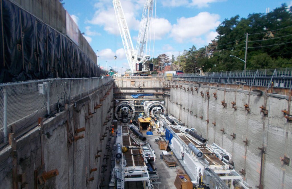 A tunnel with a crane in the middle of it.