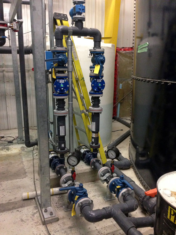 A group of pipes and valves in a building.