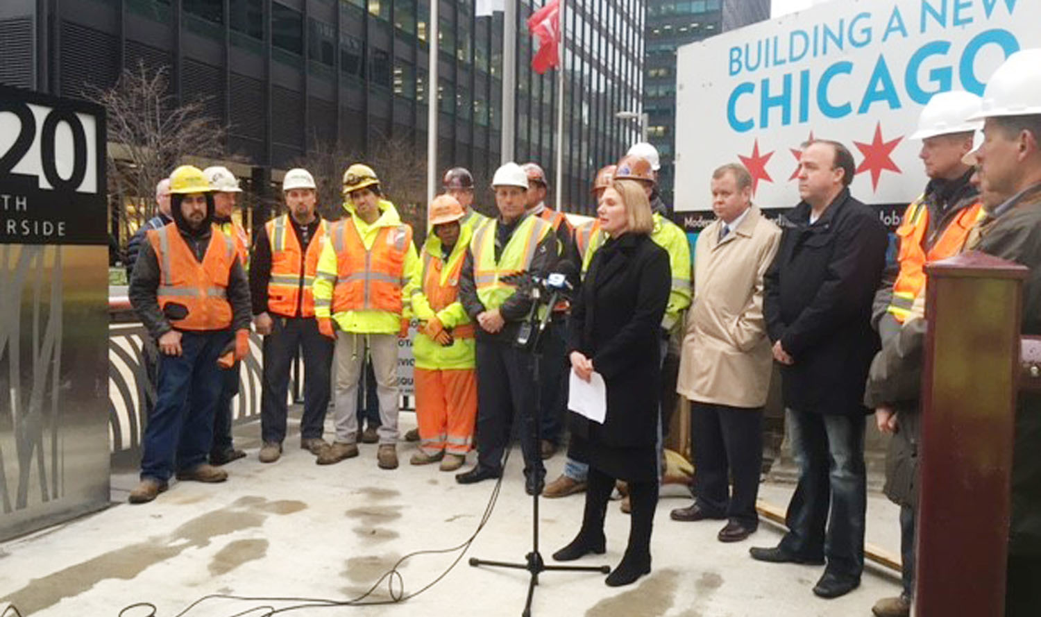 A group of people standing in front of a building in chicago.