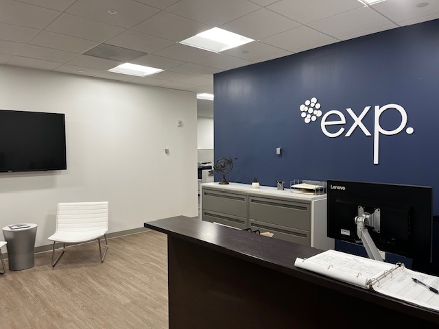 An office with the word exp on the wall.