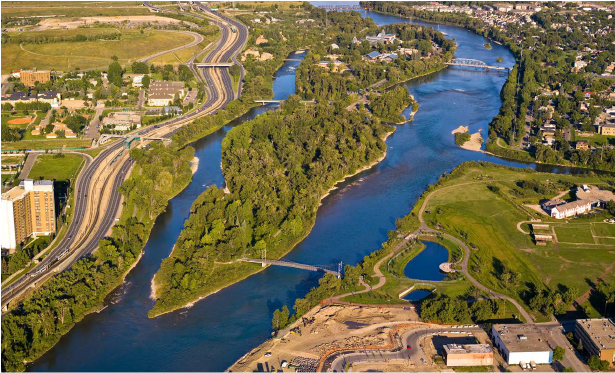 An aerial view of a river and a city.