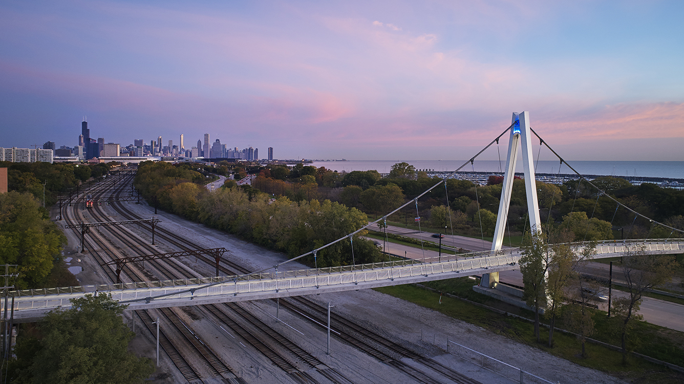 A bridge over a train track.