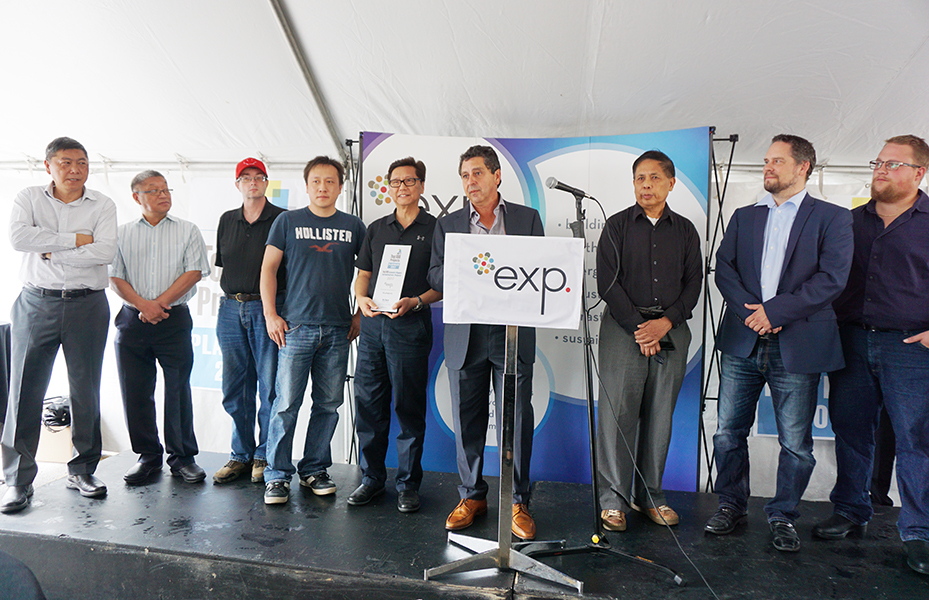 A group of people standing in front of a podium.